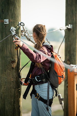 BYUI Students climbing around the ropes course by the upper fields in the summer of 2021.