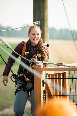 BYUI Students climbing around the ropes course by the upper fields in the summer of 2021.