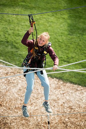 BYUI Students climbing around the ropes course by the upper fields in the summer of 2021.