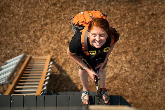 BYUI Students climbing around the ropes course by the upper fields in the summer of 2021.