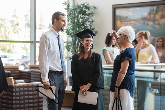 Graduates with their family and friends after the Commencement Service.