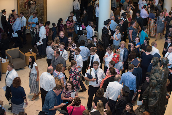 Graduates with their family and friends after the Commencement Service.