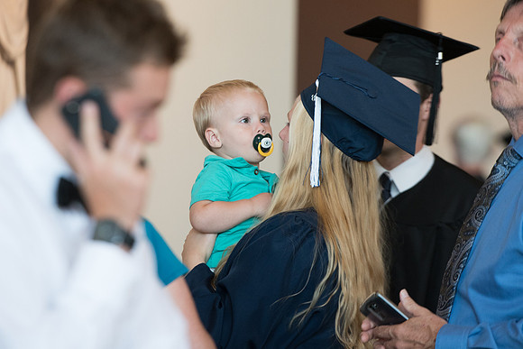 Graduates with their family and friends after the Commencement Service.