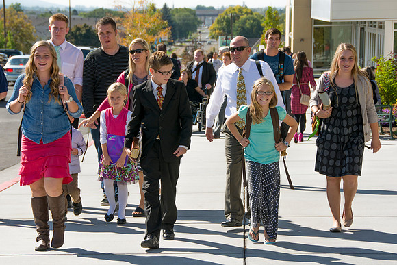 Family walking back from attending Elder Hollands devotional