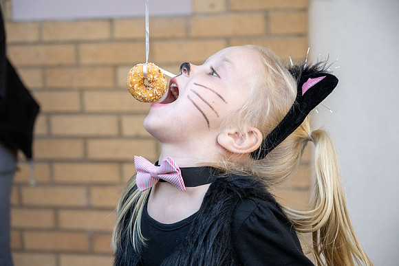 Online Learning and Teaching employees enjoy some Halloween fun at Lamprecht Hall courtyard.