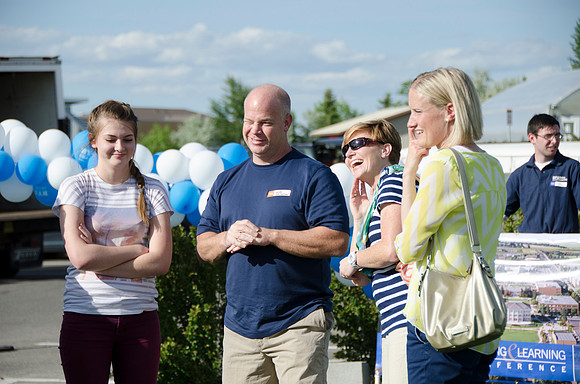 Online instructors gather with their families for an eveing of BBQ and games.