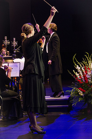 Members of the Collegiate Singers, Men's Choir, Women's Choir, and Symphony Band all perform together at the Patriots and Pioneers Concert.