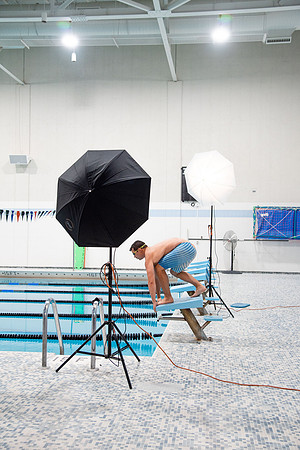Behind the scenes of Mike Lewis shooting frisbee, football, and swimming photos for Hart gym decals.