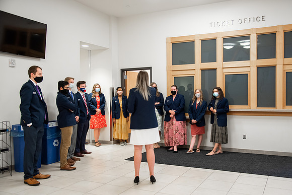 Ushers perform their duties in the I-Center to prepare for devotional. Used for an usher training video.