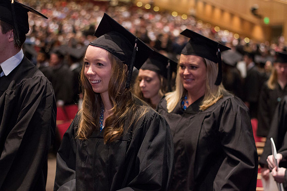 Graduates eagerly leave the I-Center at the end of Commencement during the 2014 Winter Semester Graduation.