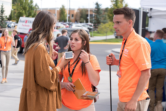 Student mentors on campus helping new students.