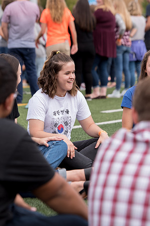 Students make new friends and get acquainted with other new students in their I-Team at the Football Field