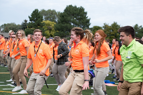 Students make new friends and get acquainted with other new students in their I-Team at the Football Field