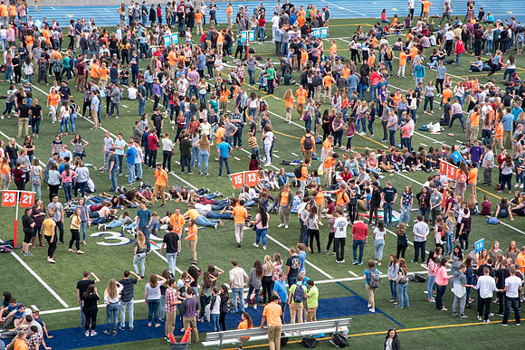 Students make new friends and get acquainted with other new students in their I-Team at the Football Field