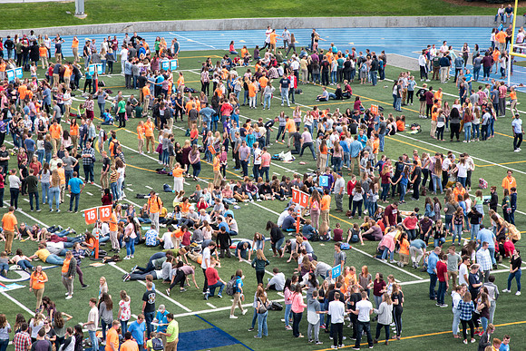 Students make new friends and get acquainted with other new students in their I-Team at the Football Field