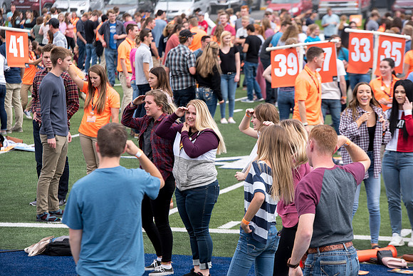 Students make new friends and get acquainted with other new students in their I-Team at the Football Field