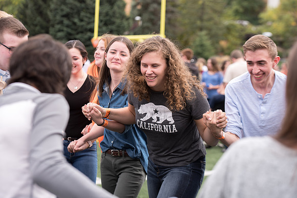Students make new friends and get acquainted with other new students in their I-Team at the Football Field