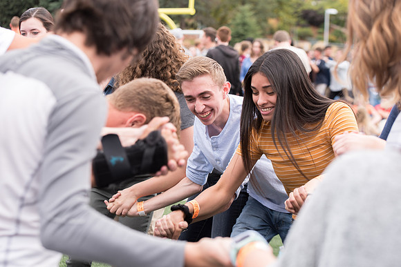 Students make new friends and get acquainted with other new students in their I-Team at the Football Field