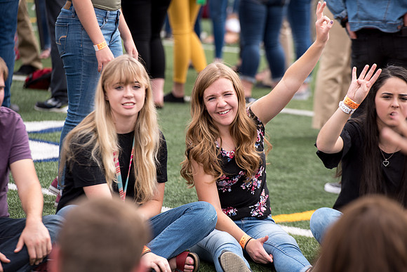 Students make new friends and get acquainted with other new students in their I-Team at the Football Field