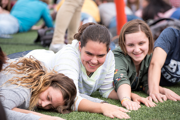 Students make new friends and get acquainted with other new students in their I-Team at the Football Field