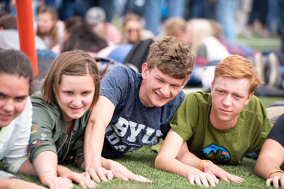 Students make new friends and get acquainted with other new students in their I-Team at the Football Field
