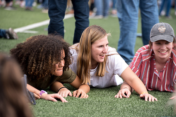 Students make new friends and get acquainted with other new students in their I-Team at the Football Field
