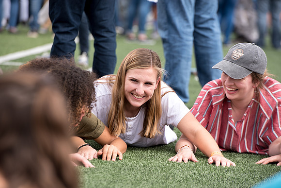 Students make new friends and get acquainted with other new students in their I-Team at the Football Field