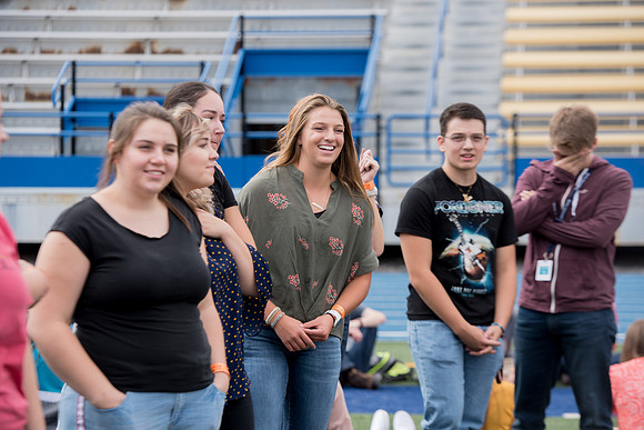 Students make new friends and get acquainted with other new students in their I-Team at the Football Field