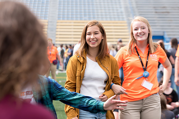 Students make new friends and get acquainted with other new students in their I-Team at the Football Field