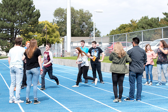 Students make new friends and get acquainted with other new students in their I-Team at the Football Field
