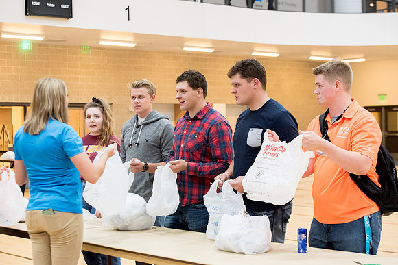 Students are assembling hygiene kits, braiding jump ropes and making plarn for plastic sleep mats.