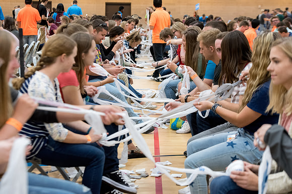 Students are assembling hygiene kits, braiding jump ropes and making plarn for plastic sleep mats.