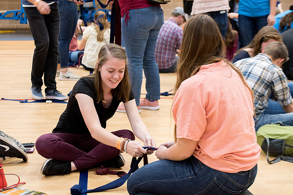 Students are assembling hygiene kits, braiding jump ropes and making plarn for plastic sleep mats.