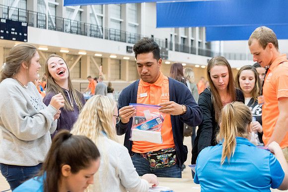 Students are assembling hygiene kits, braiding jump ropes and making plarn for plastic sleep mats.