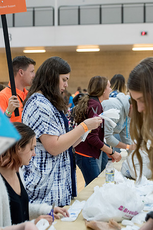 Students are assembling hygiene kits, braiding jump ropes and making plarn for plastic sleep mats.