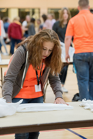 Students are assembling hygiene kits, braiding jump ropes and making plarn for plastic sleep mats.
