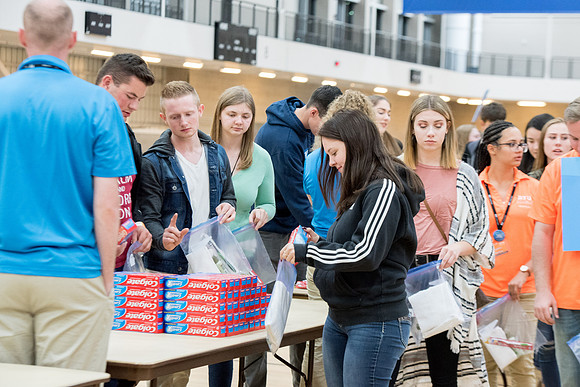 Students are assembling hygiene kits, braiding jump ropes and making plarn for plastic sleep mats.
