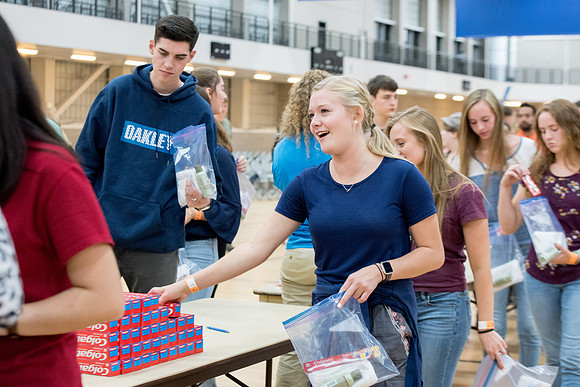 Students are assembling hygiene kits, braiding jump ropes and making plarn for plastic sleep mats.