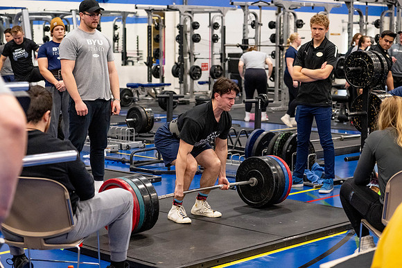 Students compete in Squat Bench and Deadlift challenges. In the BYU-Idaho gym in the Hart Building.