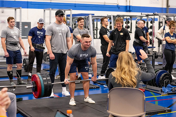 Students compete in Squat Bench and Deadlift challenges. In the BYU-Idaho gym in the Hart Building.