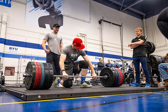 Students compete in Squat Bench and Deadlift challenges. In the BYU-Idaho gym in the Hart Building.