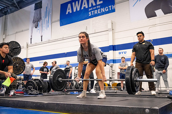 Students compete in Squat Bench and Deadlift challenges. In the BYU-Idaho gym in the Hart Building.