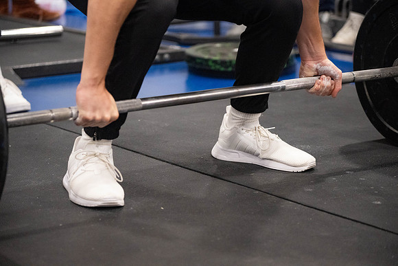 Students compete in Squat Bench and Deadlift challenges. In the BYU-Idaho gym in the Hart Building.
