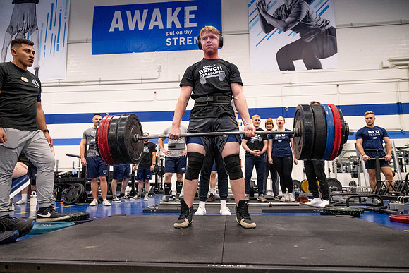 Students compete in Squat Bench and Deadlift challenges. In the BYU-Idaho gym in the Hart Building.