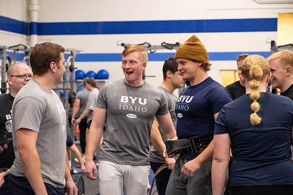 Students compete in Squat Bench and Deadlift challenges. In the BYU-Idaho gym in the Hart Building.