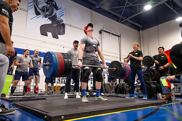 Students compete in Squat Bench and Deadlift challenges. In the BYU-Idaho gym in the Hart Building.