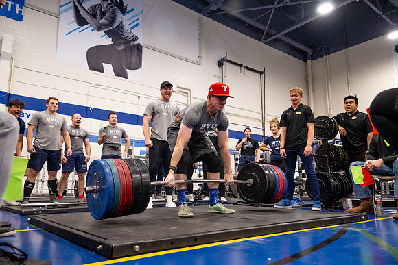 Students compete in Squat Bench and Deadlift challenges. In the BYU-Idaho gym in the Hart Building.