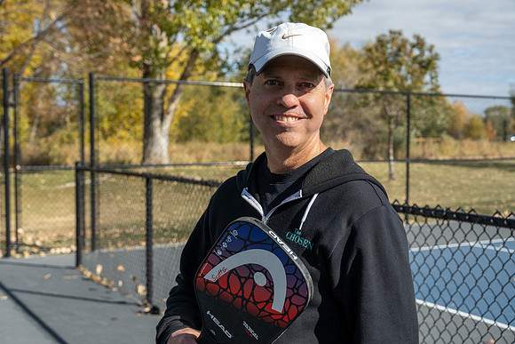 Dinking around playing pickleball for the HR Wellness Video.