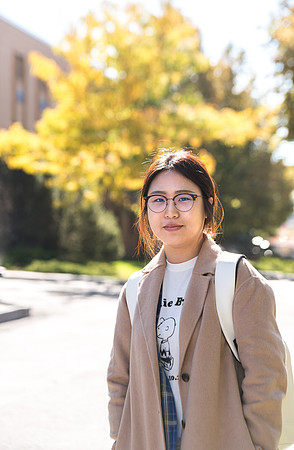 Student and University Relations employee on her way to class.