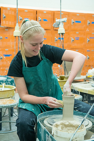 Jenna Ray working on her ceramics project.